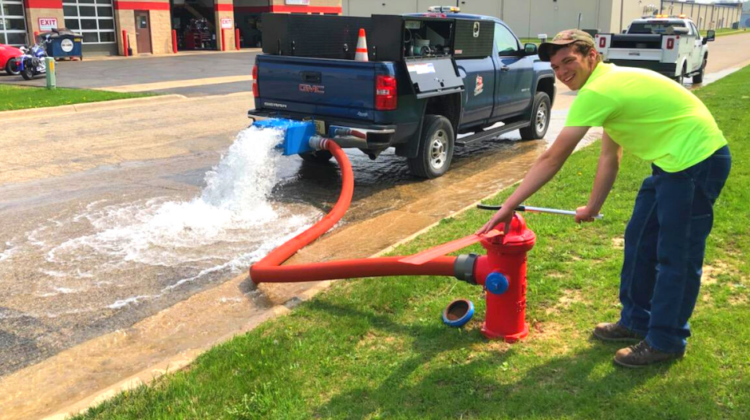 Water Department Staff member flushing hydrant